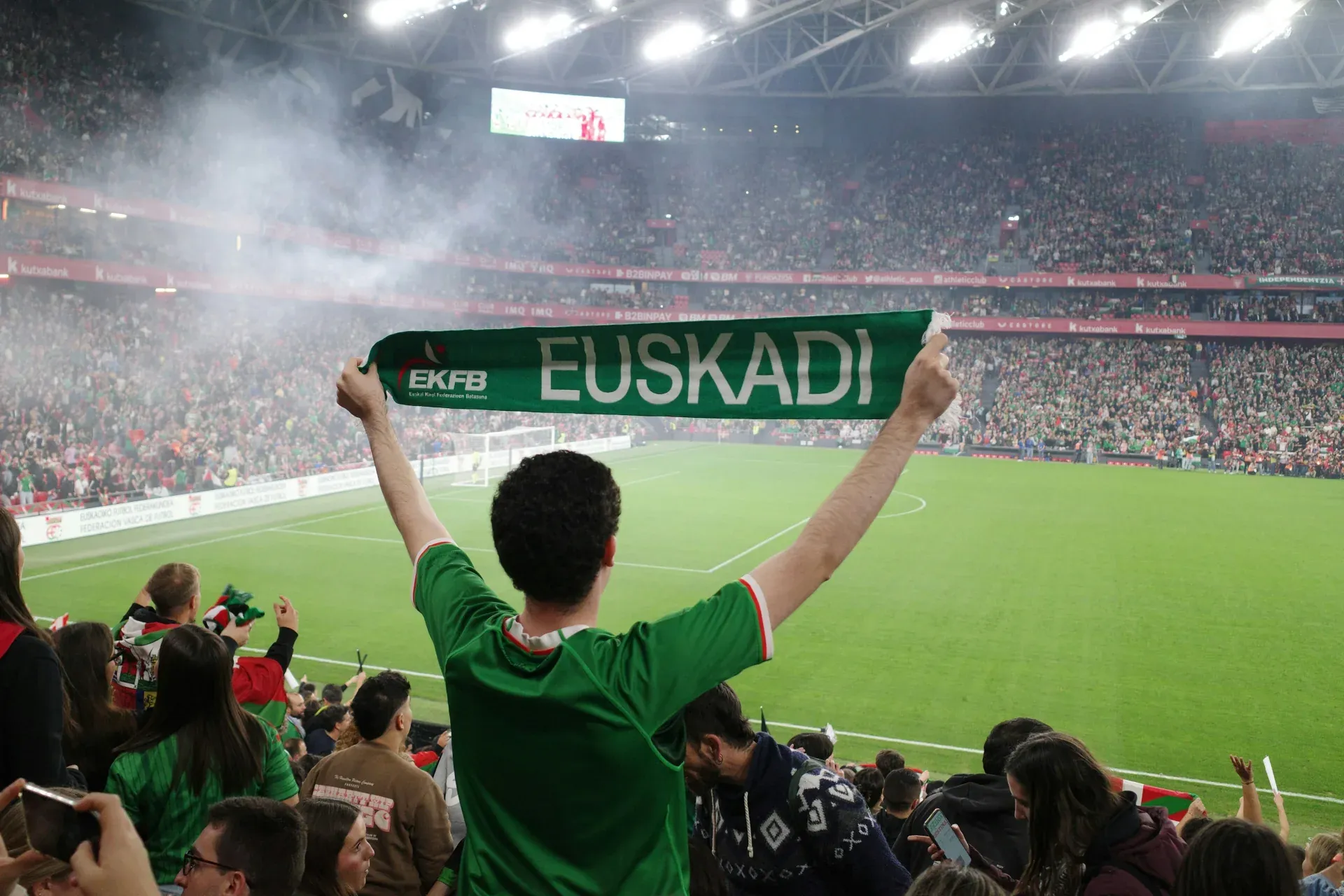 Supporter holding a scarf at a football match